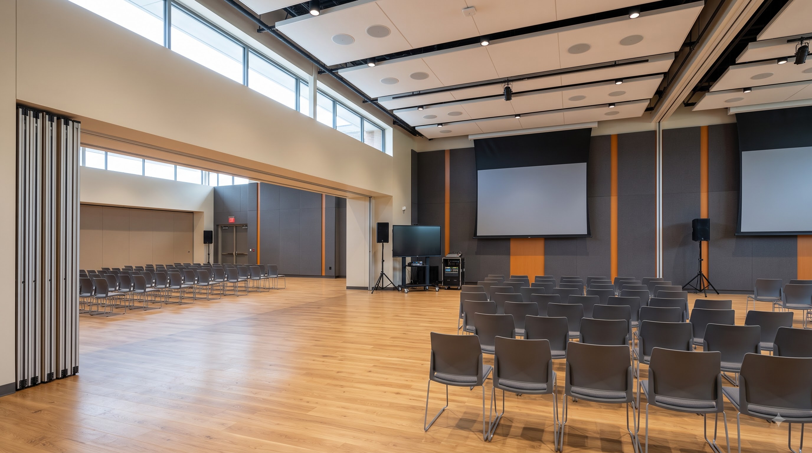 Flexible multi-purpose room with movable audio visual system and divisible configuration
